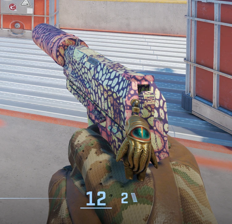 The USP-S microphone: the same golden hand, this time holding an eye.
